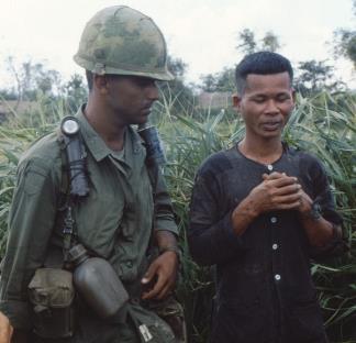 A member of the 101st Airborne questions a Viet Cong suspect during operation Van Buren.