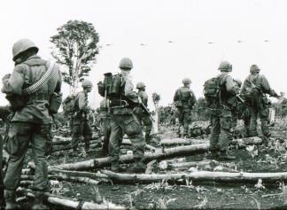 Soldiers of the 2nd Battalion, 503rd Infantry, 173rd Airborne await an airlift on operation Francis Marion.