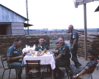MACV advisors Croft, Houser, O'Neil, Barton and Fisher enjoy a break with ARVN officer Phoi, whilst at An Phu in the northern reaches of Mekong Delta.