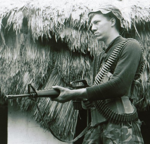 A trooper of the 101st Airborne wears a wool sweater and ERDL tropical combat trousers whilst on a short-range patrol near Fire Support Base "Sabre".