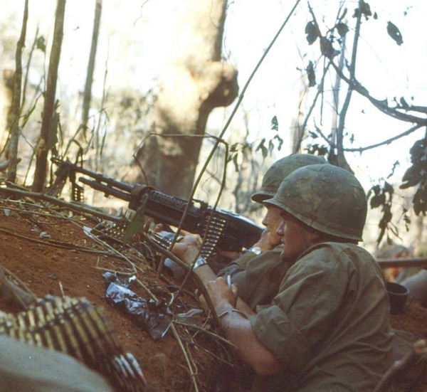A machine gun team of Company B, 4th Battalion, 173rd Airborne in action against entrenched North Vietnamese positions on Hill 875 near Dak To (Central Highlands).