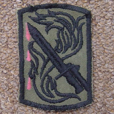 This subdued version of the 198th Light Infantry Brigade insignia has been modified with some embroidered drops of blood.