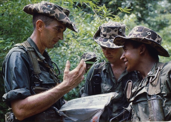 Reconnaissance team members of the 28th Infantry, 1st Infantry Division wear spotted (Beo-Gam) camouflage bush hats during operation Billings.