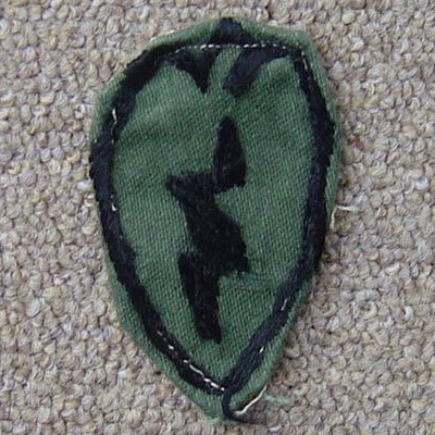 Locally made subdued version of the 25th Infantry Division's shoulder sleeve insignia.
