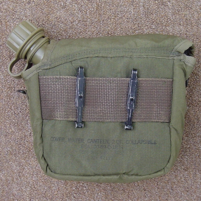 Slide keepers on the back of 2nd pattern cover could be used to attach it to the pistol belt.