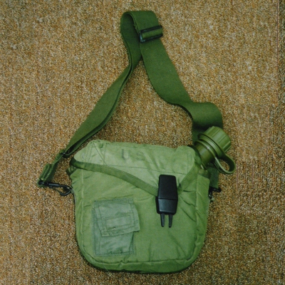 2nd pattern 2 quart canteen cover with a detachable utility strap.