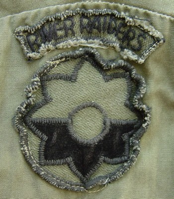 Locally made subdued version of the 9th Infantry Division's insignia with a River Raiders tab.