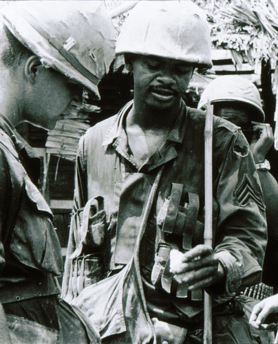 A Sergeant of the 60th Infantry, 9th Infantry Division wears a first pattern M79 Grenade Vest during an operation in the Plain of Reeds (Mekong Delta).
