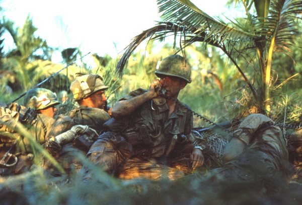 An officer of the 47th Infantry, 9th Infantry Division calls for support whilst pinned down by sniper fire near Ben Tre.