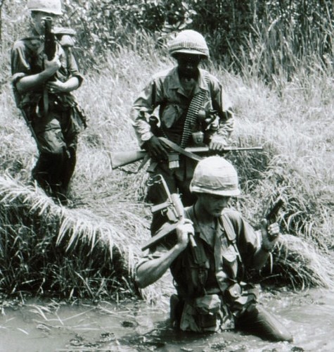 A squad of the 60th Infantry, 9th Infantry Division, cross a stream during Operation Hot Tac.