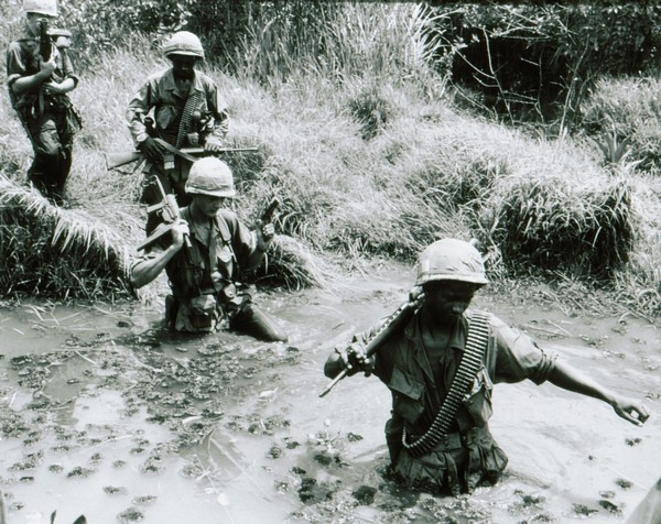 A squad of the 60th Infantry, 9th Infantry Division cross a stream during Operation Hot Tac.