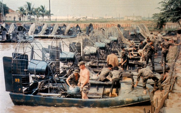 Members of  Special Forces Detachment A-404 (Company D) and the Vietnamese Mobile Strike Force prepare their airboats in the docking facility at Cau Lanh in the Mekong Delta.