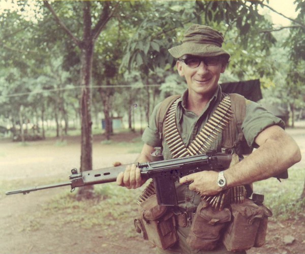 A soldier of Co ‘B’, 2nd Royal Australian Regiment, in Nui Dat carries a L1A1 SLR rifle as he moves out with his gear.