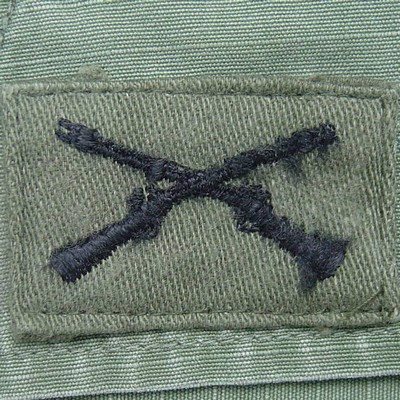 Subdued version of the Infantry Branch of Service Insignia.