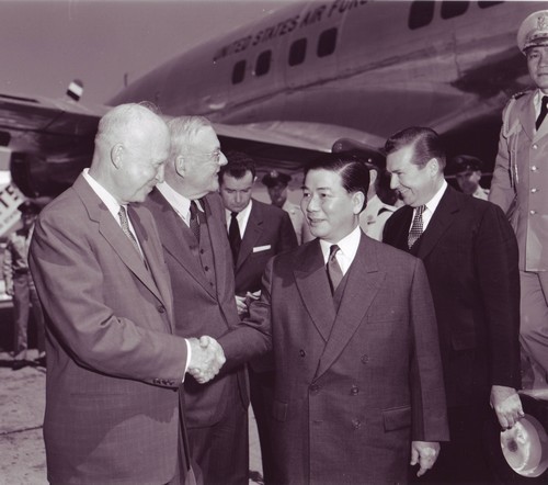 Ngo Dinh Diem is greeted at Washington National Airport by President Dwight Eisenhower and Secretary of State John Foster Dulles (2nd from left).