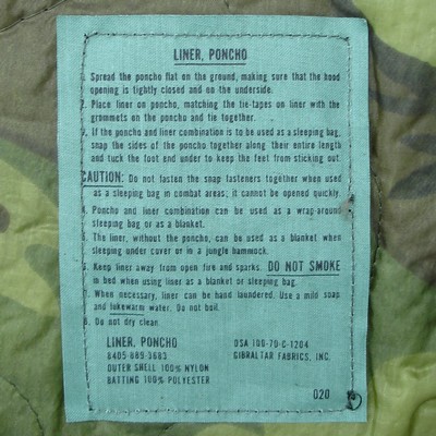 Label from a 1970 contract dated ERDL camouflage poncho liner.