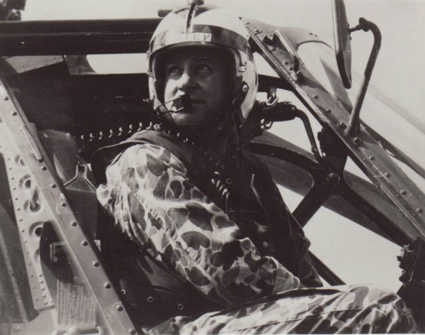 A duck-hunter (Beo-Gam) clad pilot looks out from his helicopter after touching down.