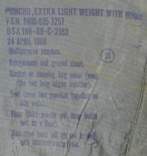 Nomenclature and instruction stamp from the OG-207 Lightweight Poncho.