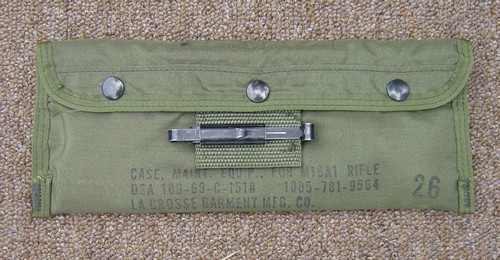The nylon M16 Cleaning Equipment Pouch was closed by three snap fasteners and featured a single slide keeper.