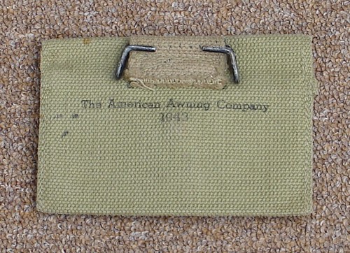 The M1942 First Aid pouch featured a double-hook hanger on the back.