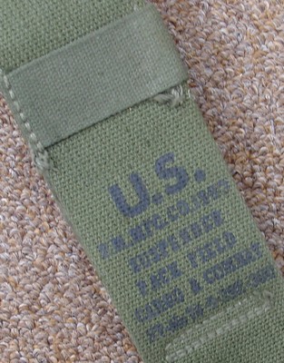 The ink stamp on M1945 suspenders displays the official nomenclature: Suspenders, Pack Field Cargo & Combat.
