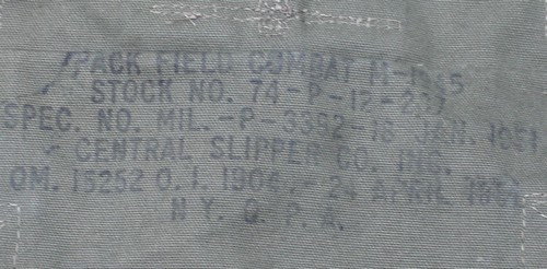 Nomenclature stamp on the inside of the top flap of the M1945 combat field pack.