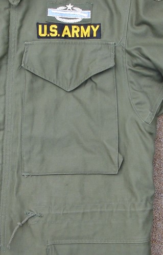 The pockets of the M1951 Field Coat featured V-cut flaps.