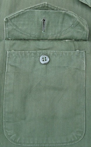 The patch pocket buttons on the Marine Corps P53 Utility Shirt were concealed behind V-cut flaps.