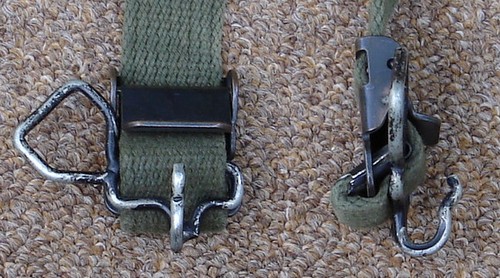 The M1956 suspenders front belt hooks featured loops for attaching the sleeping gear carrier.