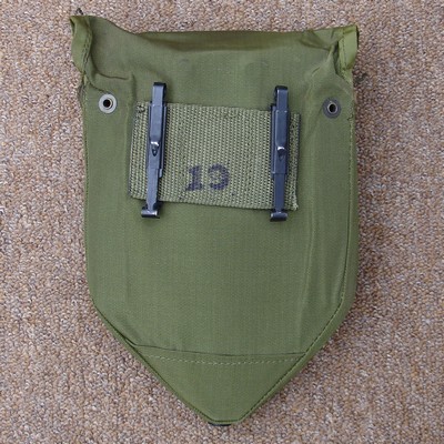 Slide keepers on the back of M1967 intrenching tool carrier could be used to attach it to the pistol belt.