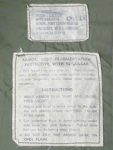 Identification and instruction labels from the 823 series M69 flak vest.