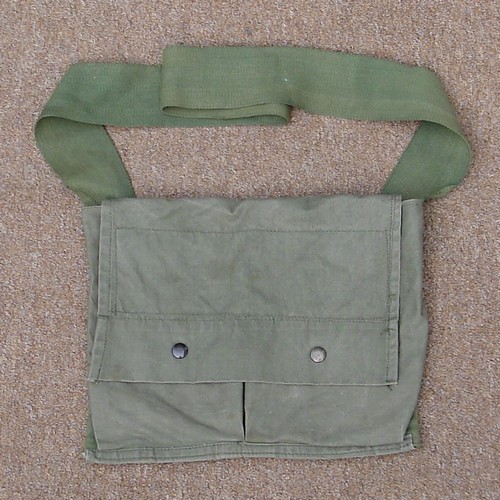The flap of the M7 Bandoleer was secured by two snap fasteners.