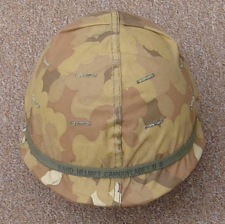 The helmet cover's brown / winter side was rarely used in Vietnam.