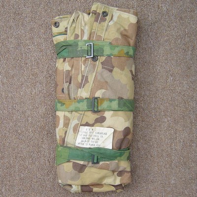 The USMC Mitchell Pattern Shelter Half could be rolled up and secured with the matching camouflage straps.