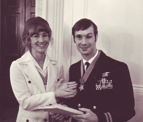 Mrs Thomas Norris and admires the Medal of Honor awarded to her husband.