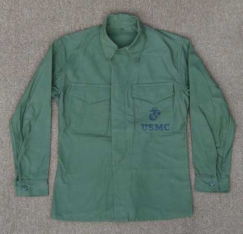 Identical to the USMC P53 shirt, but made from cotton sateen rather than HBT, the P56 featured two patch pockets with V-cut flaps and an inner map compartment.