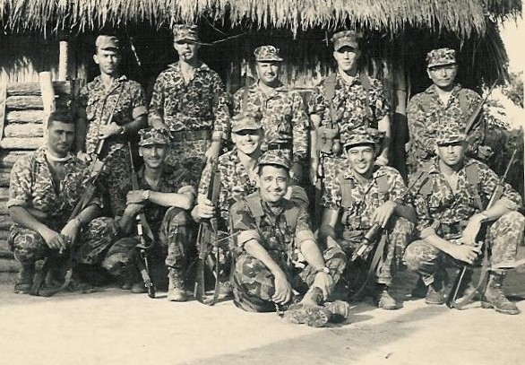 Special Forces Detachment A-321, under Captain Edward Rybat (middle row, center), at their CIDG camp at Ben Cat in War Zone "D" (III Corps).