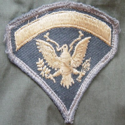 US Army Specialist 5 collar insignia.