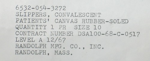 Nomenclature and contract details for the rubber soled canvas hospital slippers.