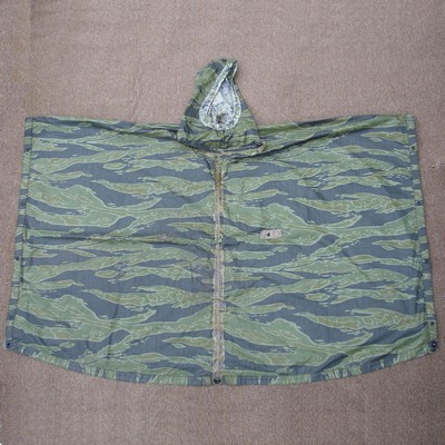 The Tiger Stripe lightweight poncho was an expermiental model produced by Natick Labs during their development of the ARVN camouflage poncho.