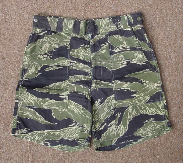 JWD tiger stripe shorts with two front patch pockets and waist adjustment tabs.
