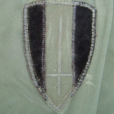 Locally made subdued USARV shoulder sleeve insignia.