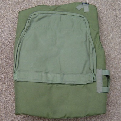 The front and back of the vest featured large nylon pockets to accommodate the ceramic/fiberglass composite armor plates.