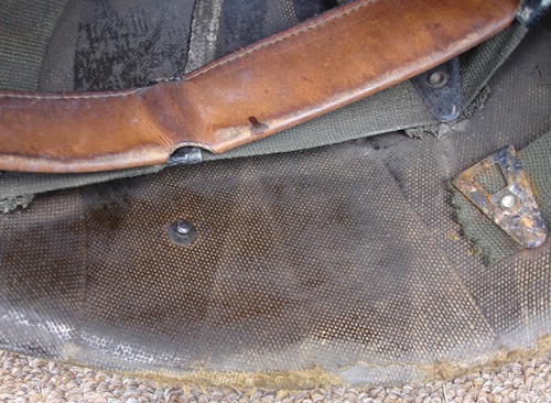 Like the P51 Infantry Helmet Liner, the P55 had a leather chin strap that attached to studs on either side of the liner.
