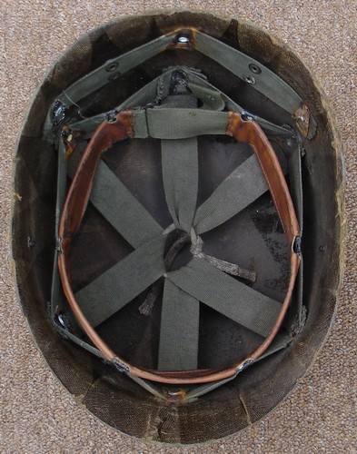 The P55 Infantry Helmet Liner featured suspension webbing that could be adjusted to hold the liner at the right height on the wearer's head.