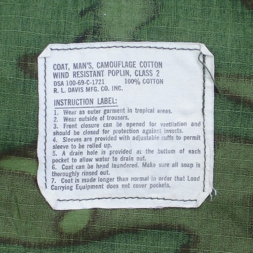 Nomenclature, contract and instruction label from the 5th pattern Tropical Combat Jacket.