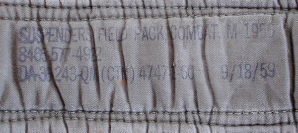 The contract and nomenclature stamp was on the underside of the padded shoulder section of the M1956 Suspenders.