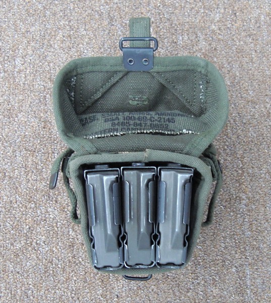 The 2nd pattern Universal Ammunition Pouch could accommodate three M14 magazines, rather than just two.