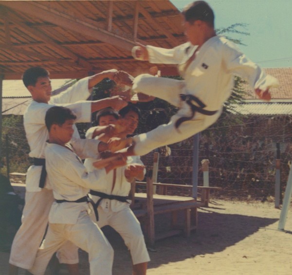 Sergeant  Lee Yong Bok executes a flying kick during a Tae Kwon Do demonstration held by the Korean Capital (Tiger) Division.