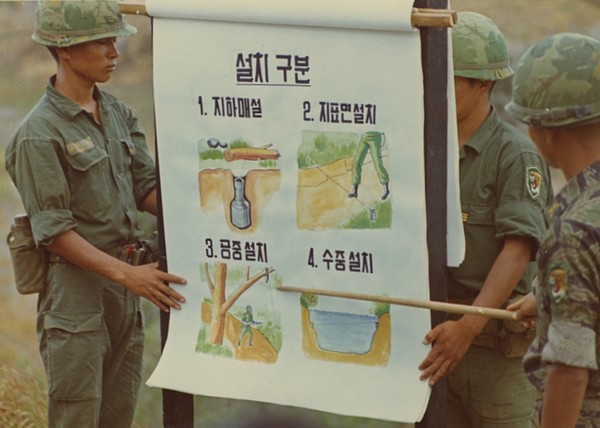 Soldiers of the 26th Regiment, ROK Tiger Division, give a presentation on the various types of booby-trap used by the Viet Cong.